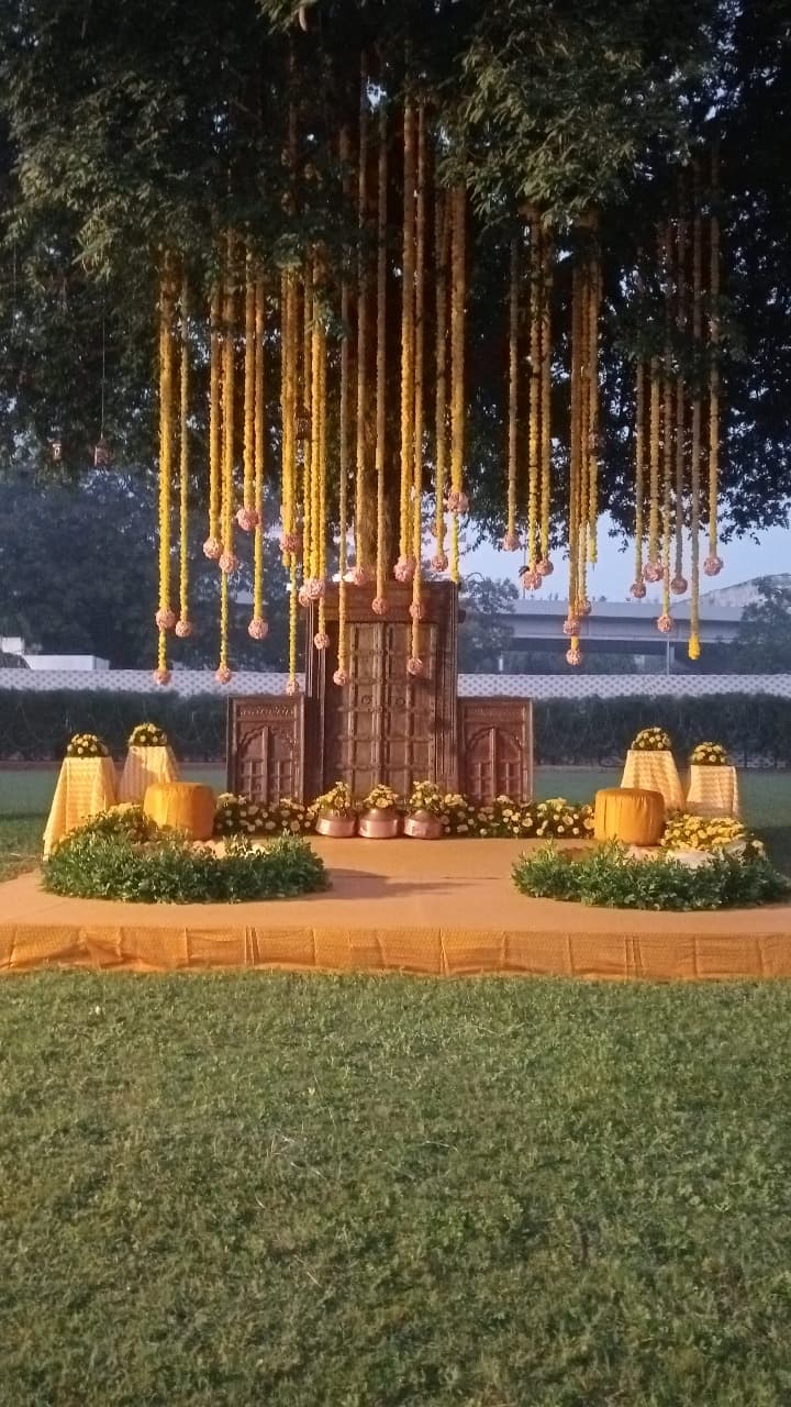 Marigold haldi ceremony setup on the lawn at Shivmahal Palace