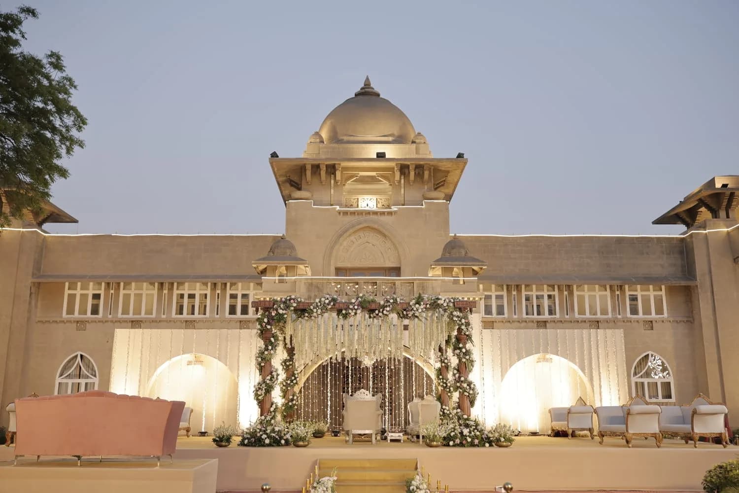 Mandap with hanging floral strings in front of the palace at Shivmahal Palace, Vadodara