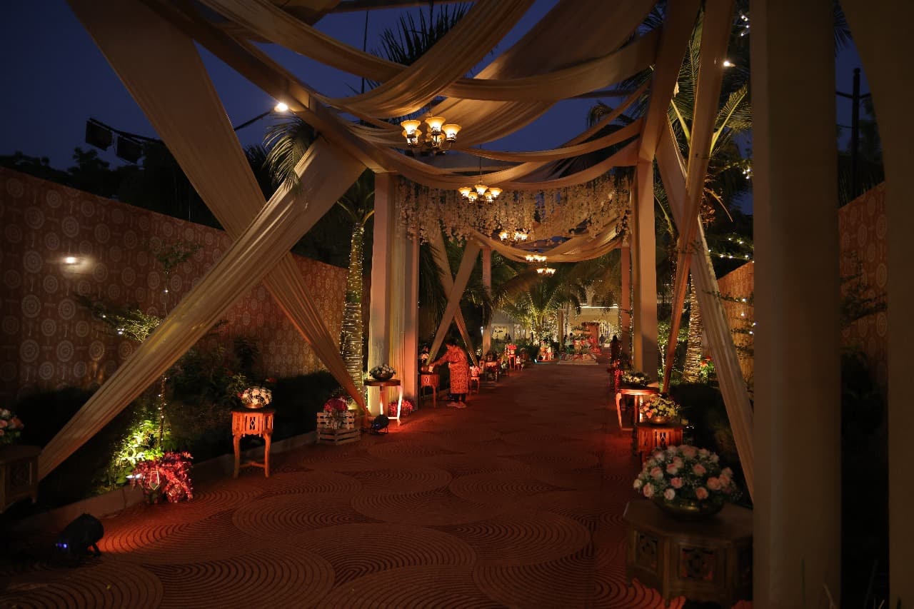 Lantern-lit draped walkway at night at Shivmahal Palace, Vadodara