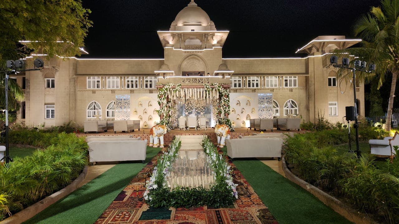 Wedding mandap set against the palace facade at Shivmahal Palace, Vadodara