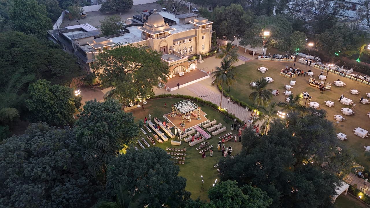Open wedding lawn at Shivmahal Palace, Vadodara, set with guest seating and a stage